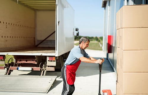 Omni employee unloading truck load