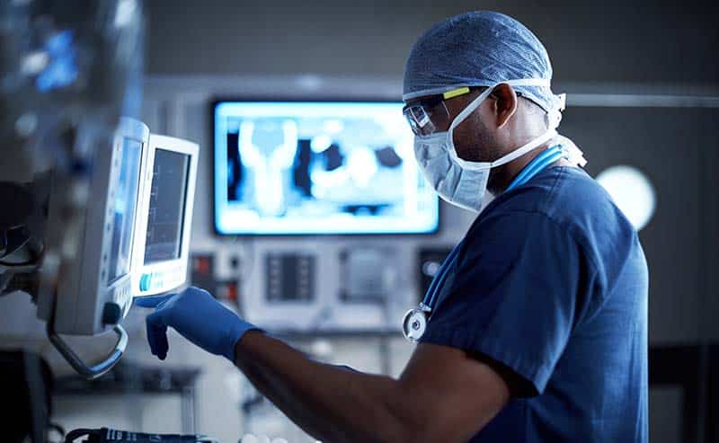 healthcare worker using machine
